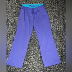 Scrub Star. Size Medium. Purple and turquoise.